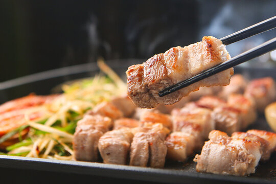 Korean pork samgyeopsal grilled tableside