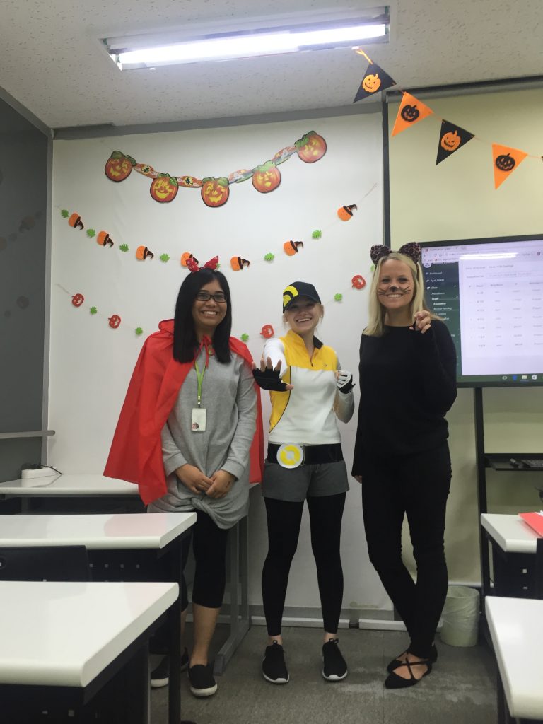 A few native English language teachers posing in Halloween costumes at a Chungdahm Learning location in Korea