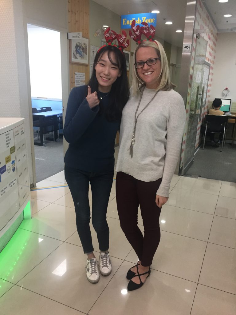 Foreign English language teacher posing with a Korean staff member at a Chungdahm Learning institute in Korea