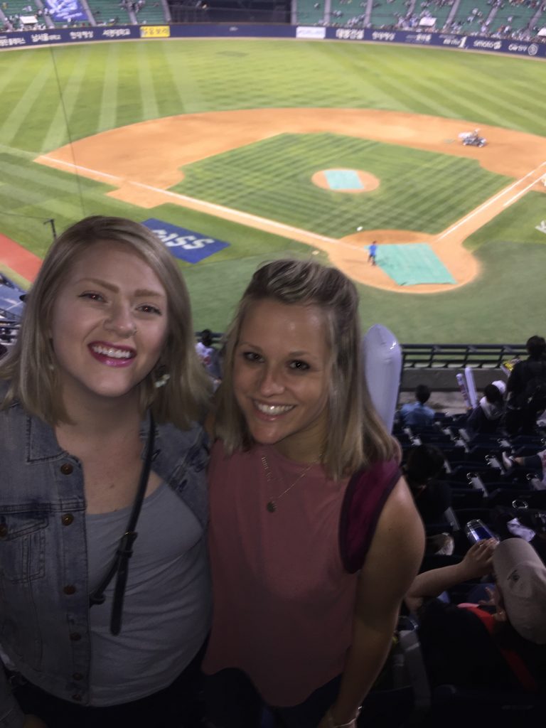 Two foreign English language teachers posing at a baseball game in Korea