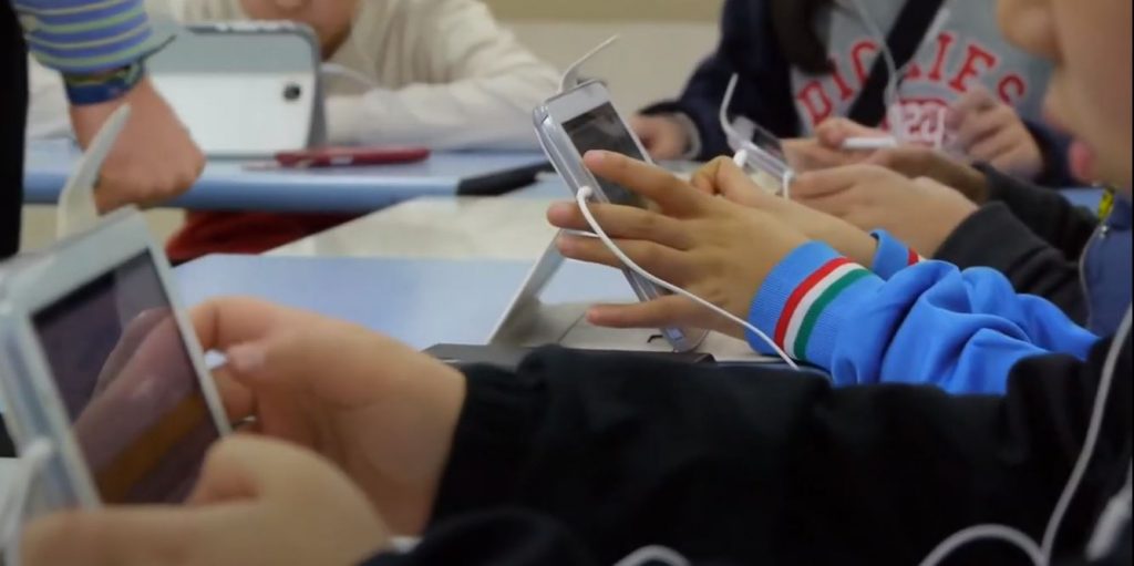 students using tablets in classroom