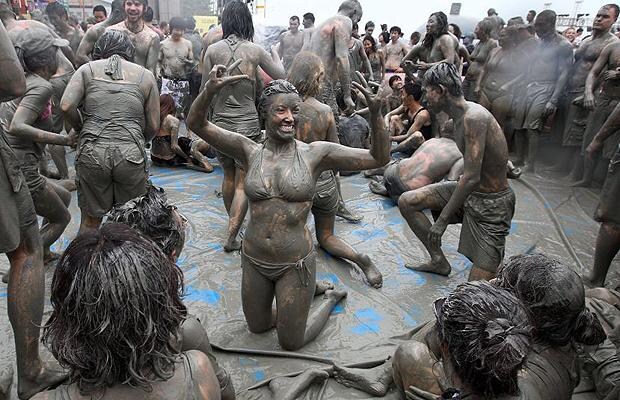 People frolic in the mud at Boryeong Mud Festival