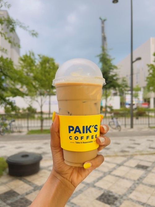 hand holding a paik's ice coffee in sejong, korea