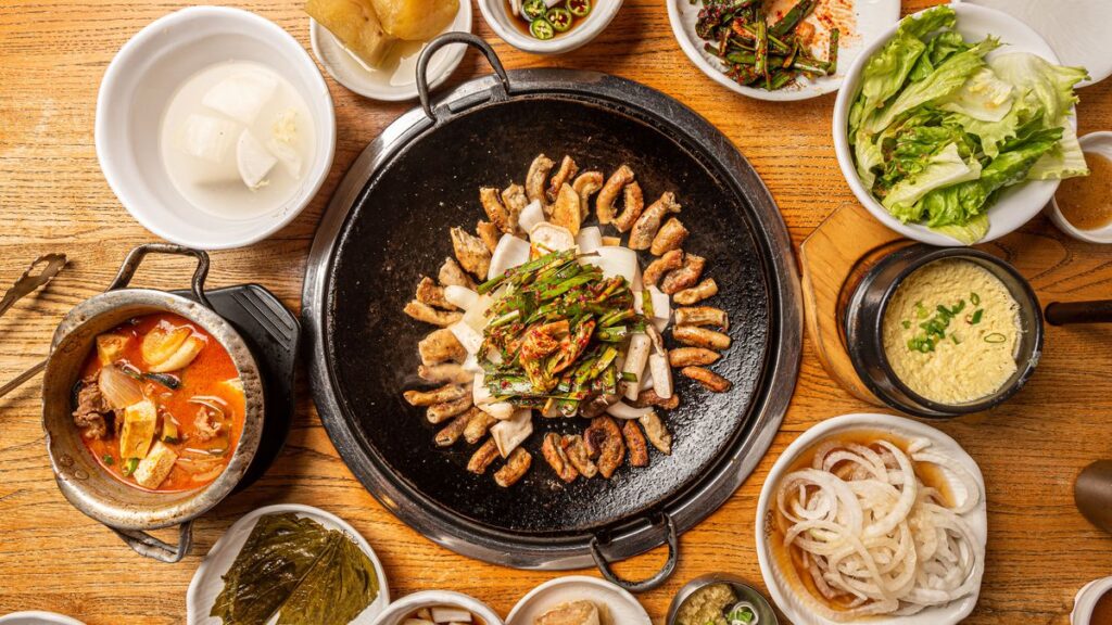 Areal photo of a table of Korean Gopchang BBQ or cow intestines.