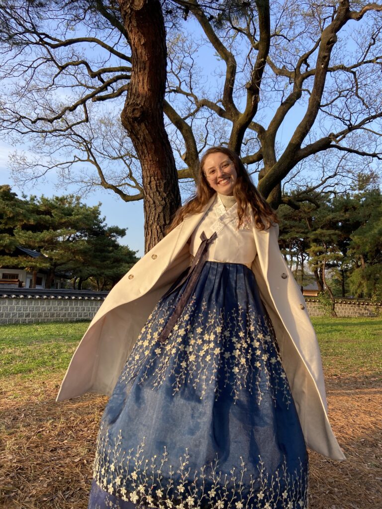 A western woman wearing a traditional Korean dress called Hanbok in South Korea