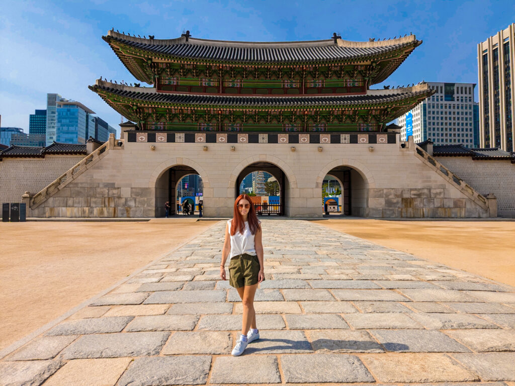 English teacher posing for a picture in from of the Gyeongbukgung Palace in South Korea