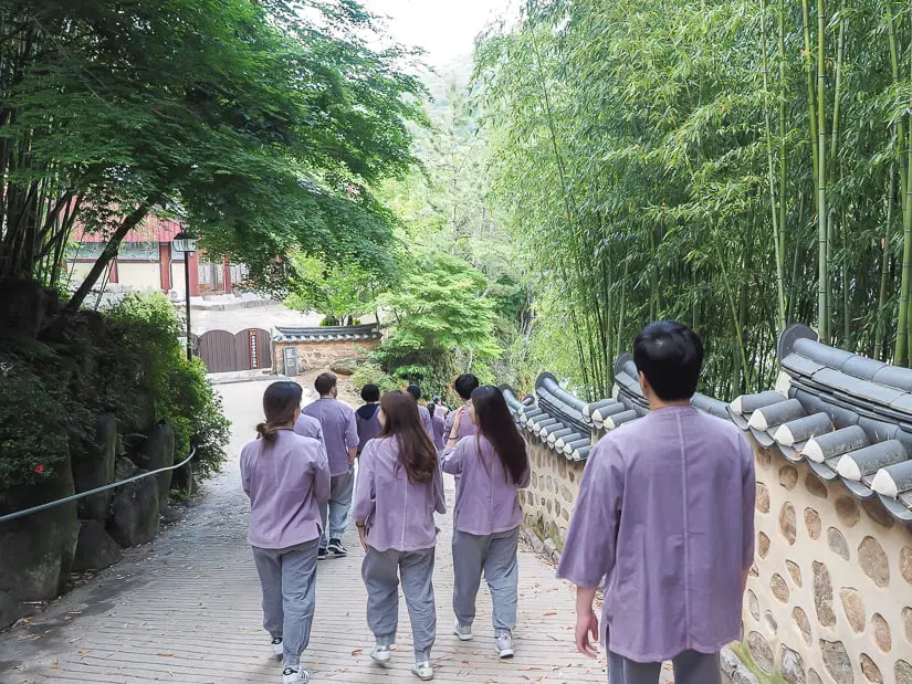 People taking a walk inside the grounds at a Buddhist temple in Kora